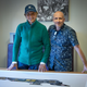 Artist Alan Thornton, right, and Emerson Fittipaldi.